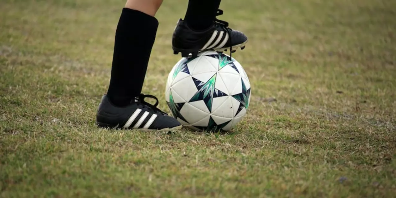 What is the purpose of spikes on soccer shoes?